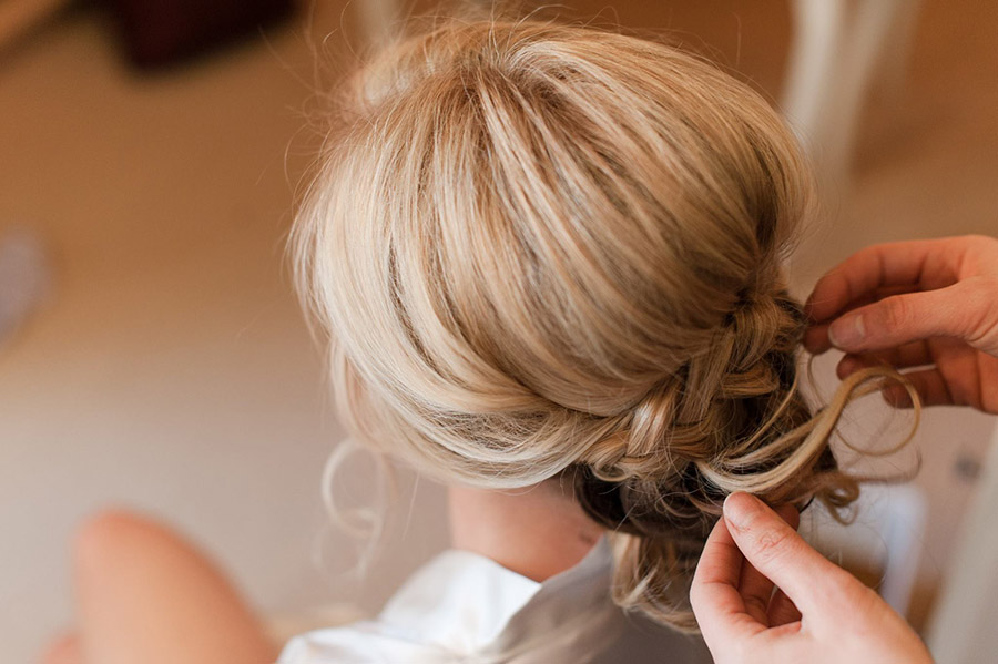 Mobile hair design artist from Beauty on Location Studio styling a Colorado bride